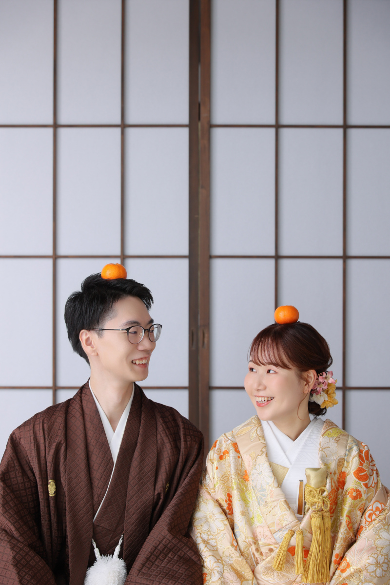 みかんを頭にのせて