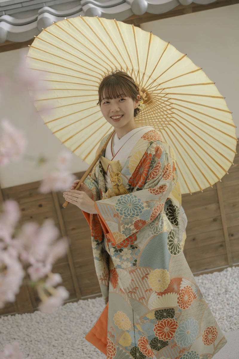 傘を持って