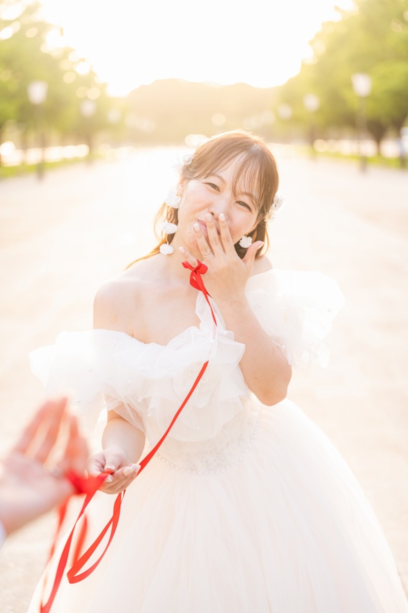 持ち込みの赤いリボンをアクセントにした笑顔の1枚