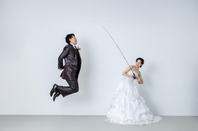 新婦様がグッと竿を引くと……