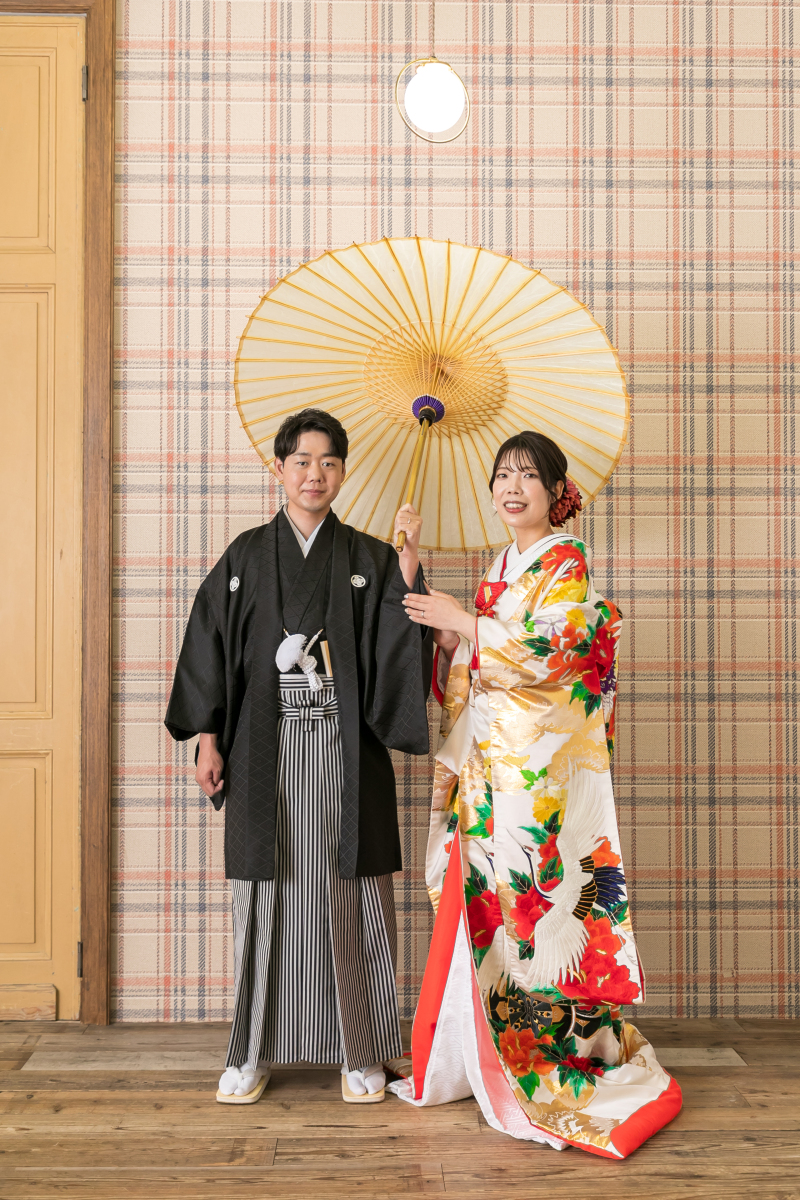 二人で傘に入って